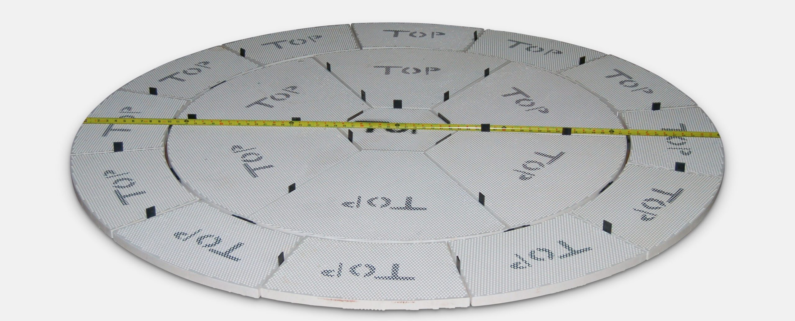 a measuring tape across a refractory with the word top on it.