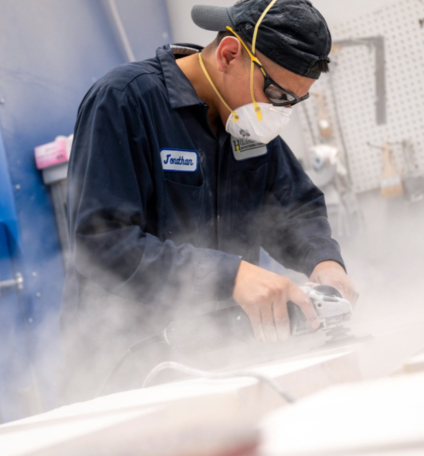 person using sanding tool